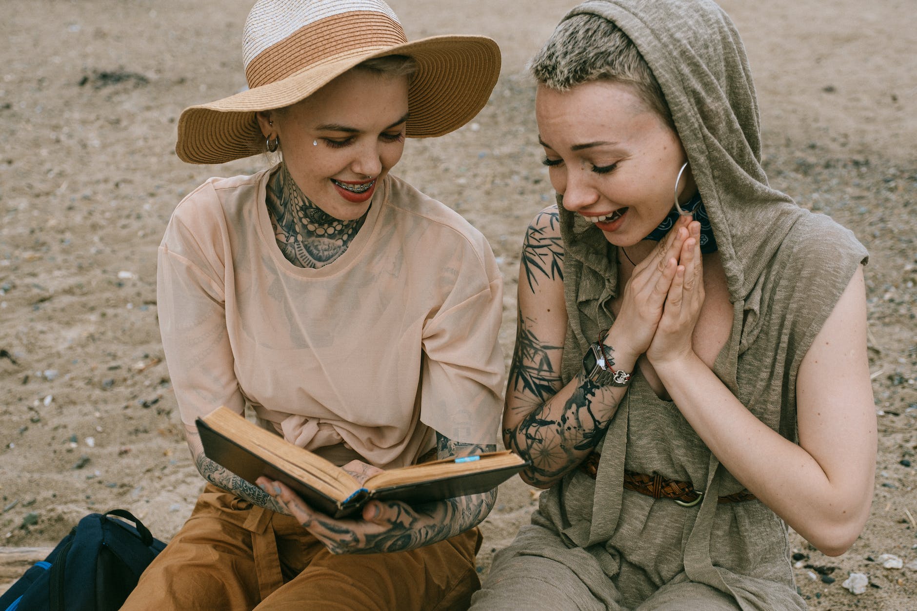 Emotion and Empathy - photo of women laughing while reading a book